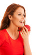 © Samo Trebizan - woman eating red apple isolated over white backgoround