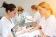 © Production Perig - Young attractive beautician students practising during courses