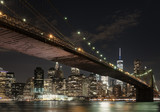 Fototapeta  - The downtown Mahnattan skyline and the Brooklyn Bridge at night
