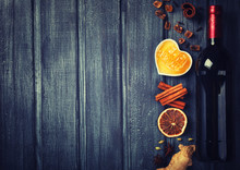 Mulled Wine,ingredients.Christmas Or Winter Warming Drink. Honey, Orange, Cinnamon Sticks, Cloves ,ginger,cardamom And Sugar.Toned Image.Vintage Style. Copy Space.selective Focus