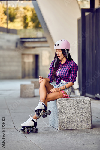 Girl Hit A Leg While Roller Skating In Urban Skate Park Young