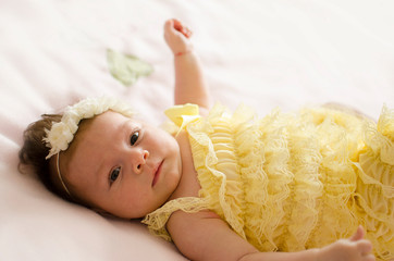 Canvas Print - baby girl lying on back