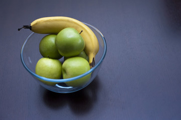 Crisp green apples and a ripe banana