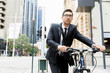 © Sergey Nivens - Young businessmen with a bike