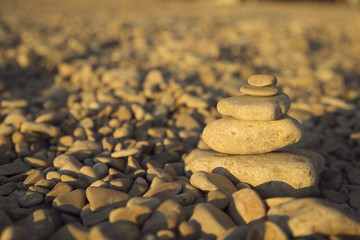 Canvas Print - Balance and harmony concept. Stones and rocks balance on the bea