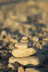 Canvas Print - Balance and harmony concept. Stones and rocks balance on the bea