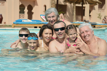 Poster - Family relax in  pool