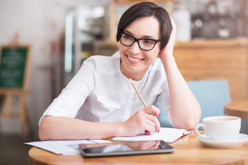 Wall Mural - Attractive businesswoman sitting at table