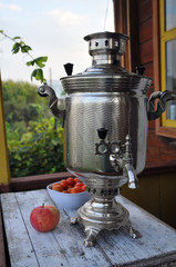 Samovar traditional russian teapot in the garden 