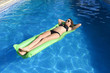 © Wordley Calvo Stock - beautiful woman in bikini lying relax on float airbed at vacacti