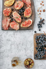 Sticker - Different snacks for wine on wooden board