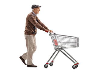 Elderly man pushing a shopping cart