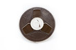 © AlexBr - Vintage magnetic audio tape reel on white background