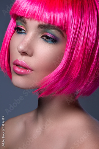 Naklejka ścienna Potrait of young woman with pink hair