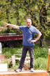 © franco lucato - man on a wooden plank pointing and listening