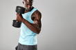 © Jacob Lund - Fit and young man working out with dumbbells