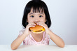 Leinwandbild Motiv Asian Chinese little girl Eating Burger