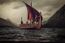Vikings Are Floating On The Sea On Drakkar With Mountains On The