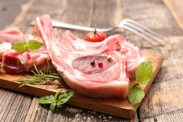 Canvas Print - raw lamb chop on board