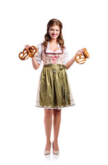 Wall Mural - Beautiful woman in traditional bavarian dress holding pretzels