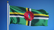 Dominica flag waving against clean blue sky, close up, isolated with clipping path mask alpha channel transparency