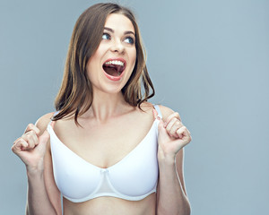 Wall Mural - Surprising woman portrait with breast in bra