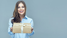 Business woman holding paper gift box