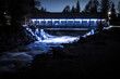 Beautiful blue light lighting the foot bridge over Fitzsimmons creek at night.