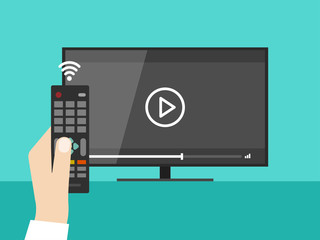 Hand holding wireless remote control near flat screen tv watching video film, cartoon person watching movie on television display