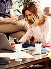 Two Young Business People Gathered Together Discussing Creative Idea Cafe.Coworkers Meeting Communication Discussion Working Office Startup Concept.Modern Electronic Gadgets Table Blurred Background