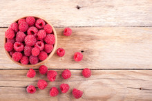 Ripe Sweet Raspberries In Bowl On Old Wooden Table. Copy Space, Top View