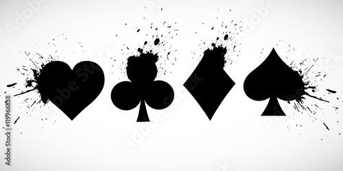 Fotografía The suits of the deck of playing cards on a background of splashing