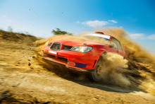 Powerful Red Rally Car In The Drift On Dirt Road