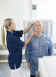 © Tyler Olson - Radiologist Adjusting Head Of Male Patient Before Taking Xray