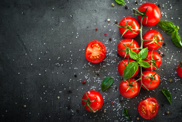 Fresh cherry tomatoes on a black