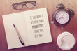 Inspirational motivating quote on notebook with vintage filter