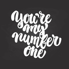 You're my number one- hand drawn lettering phrase isolated on the chalkboard background. Fun brush ink inscription for photo overlays, greeting card or t-shirt print, poster design