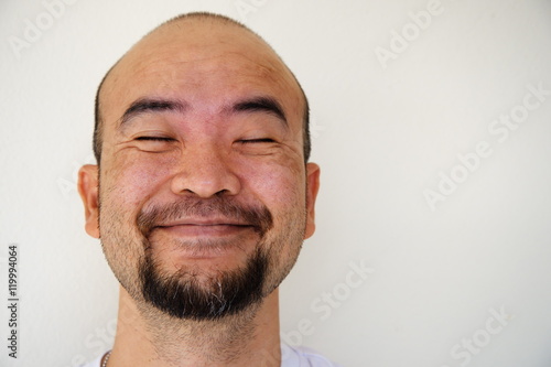 happy smiling beard bald asia man on white background - Buy this stock ...