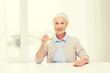 © Syda Productions - happy senior woman with glass of water at home