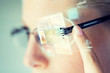 © Syda Productions - close up of woman in glasses with virtual screen