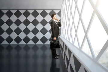 Wall Mural - Thoughtful businessman in chessboard interior