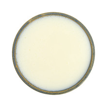 Bowl Of Buttermilk On A White Background Top View. 