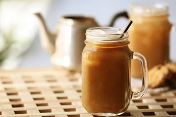 Poster - Iced coffee in glass jar on wooden table