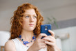 © Sergey Nivens - Happy beautiful young businesswoman using smart phone smiling