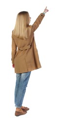 Wall Mural - Back view of pointing young women in parka. blonde in a brown raincoat is pointing to the sky.