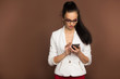 © dubogray1985 - beautiful brunette in glasses and a business suit with a mobile