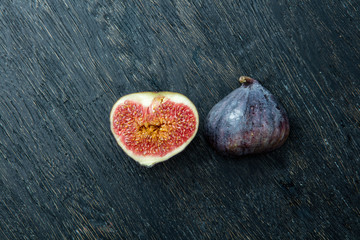 Wall Mural - Fresh figs isolated on black