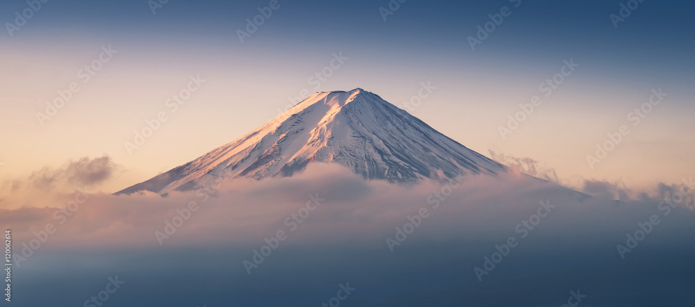 Mount Fuji enshrouded in clouds with clear sky from lake kawaguchi, Yamanashi, Japan - obrazy, fototapety, plakaty 