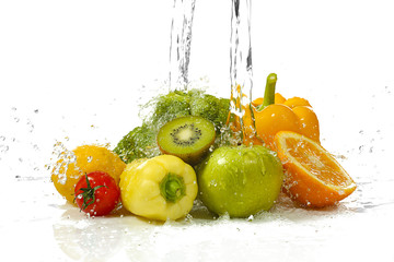 Wall Mural - Vegetables and fruits with  splashing water on white background