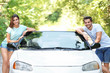 © Africa Studio - Beautiful couple standing near car on road